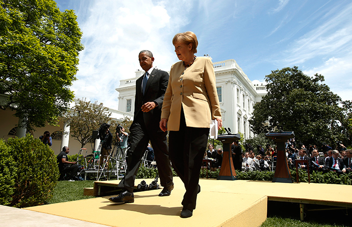 U.S. President Barack Obama and German Chancellor Angela Merkel walk from the Rose Garden after speaking to reporters about their earlier meeting at the White House in Washington May 2, 2014 (Reuters / Kevin Lamarque)