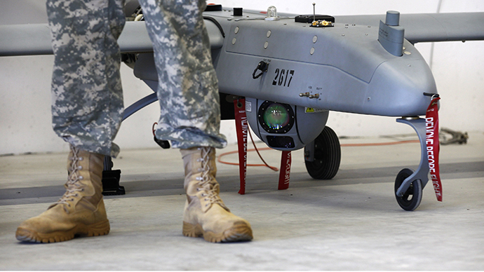 A soldier stands in front of a 'Shadow' drone during presentation by UAS at US military base in Vilseck-Grafenwoehr (Reuters / Michaela Rehle)