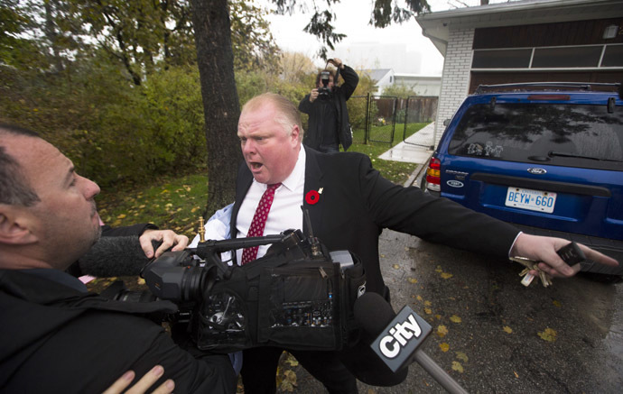 Toronto Mayor Rob Ford yells at reporters and photographers to get off of his property in front of his house in Toronto October 31, 2013. (Reuters/Mark Blinch)
