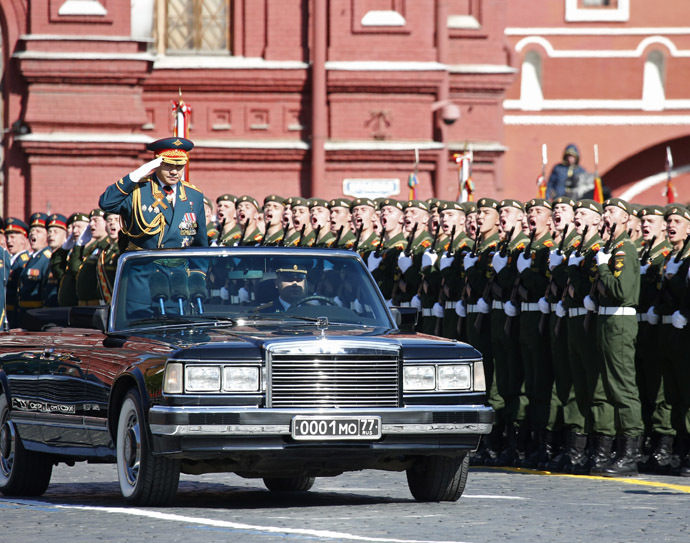 Russian Defence Minister Sergei Shoigu (L) salutes during the Victory parade in Moscow's Red Square May 9, 2014. (Reuters)