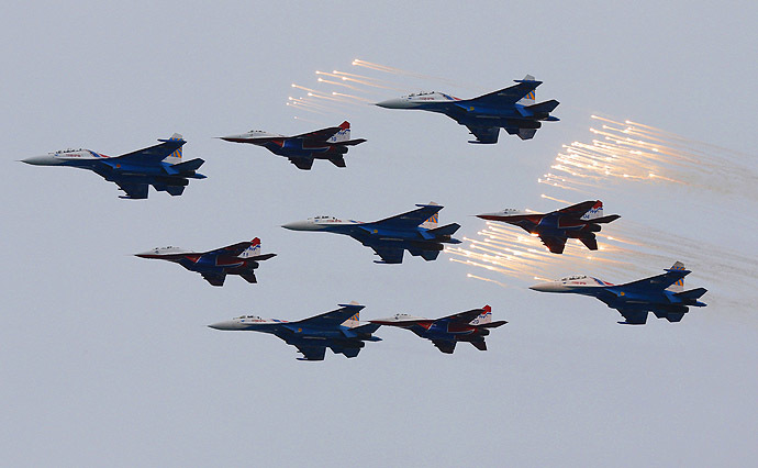 Planes from Russia's military aerobatics teams Strizhi (Swifts) and Russian Knights perform during events marking Victory Day in Sevastopol May 9, 2014. (Reuters/Maxim Shemetov)