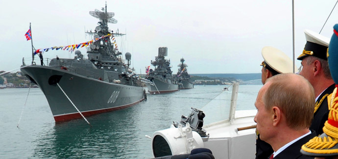 Russia's President Vladimir Putin (R) reviews ships of Russian Black Sea fleet during a visit to the Crimean port of Sevastopol on May 9, 2014. (RIA Novosti/AFP/Alexey Druzhinin)