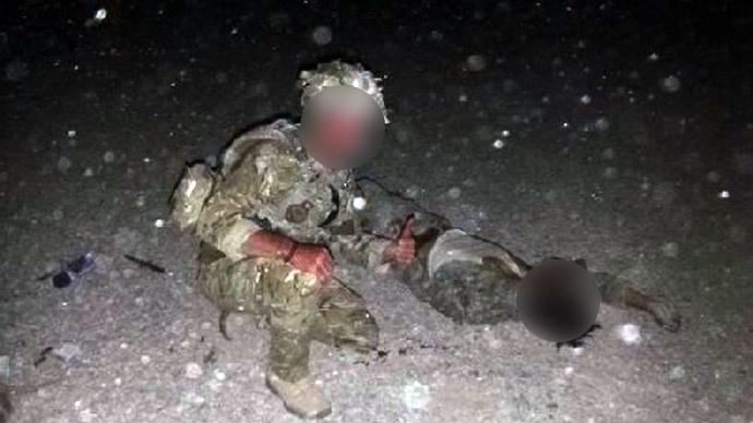 Images of UK soldier posing with dead Taliban insurgent emerge online