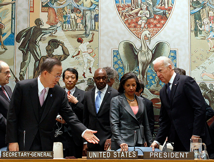 United States Vice President Joe Biden (R) sits with UN Secretary General Ban Ki-moon (L) as U.S. Ambassador to the UN Susan Rice stands (C) before the start of the United Nations Security Council High-Level Meeting on Iraq at U.N. headquarters in New York, December 15, 2010 (Reuters)