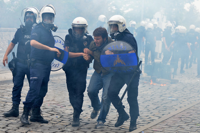 Riot police detain a protester as he and others demonstrate to blame the ruling AK Party (AKP) government on the mining disaster in western Turkey, in Ankara May 14, 2014. (Reuters)