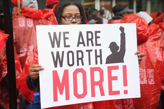 Fast food workers and activists demonstrate outside McDonald's downtown flagship restaurant on May 15, 2014 in Chicago, Illinois. (AFP Photo / Getty Images / Scott Olson)