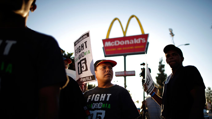 Demonstrators take part in a protest to demand higher wages for fast-food workers outside McDonald's in Los Angeles, California May 15, 2014.(Reuters / Lucy Nicholson)