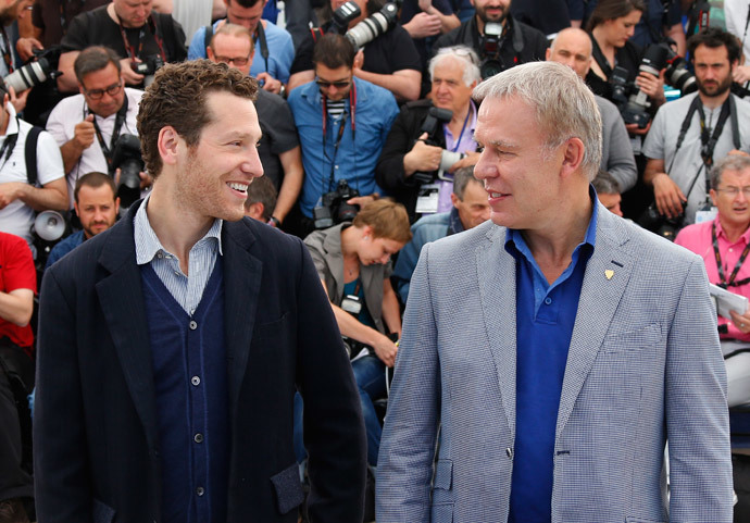 Director Gabe Polsky (L) and Slava Fetisov, the former Captain of the Russian Red Army hockey team, pose during a photocall for the film "Red Army" out of competition at the 67th Cannes Film Festival in Cannes May 16, 2014.(Reuters / Yves Herman)