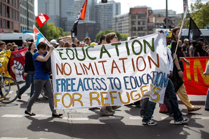 Protesters hold a banner during a Blockupy movement protest on May 17, 2014 in Berlin. (AFP Photo/DPA/Maja Hitji)