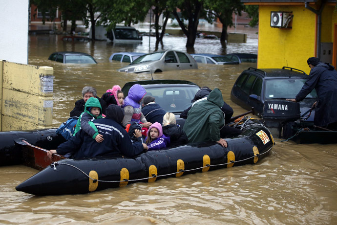People evacuate in a boat in the flooded town of Obrenovac, southwest of Belgrade, Serbia May 17, 2014. (Reuters/Marko Djurica)
