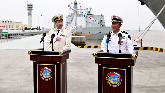 Tian Zhong (R), deputy commander of the Chinese Navy and Alexander Fedotenkov, deputy commander-in-chief of Russian Navy, attend a news conference as directors of the upcoming "Joint Sea-2014" naval drill, at a port in Shanghai, May 18, 2014.(Reuters / China Daily)