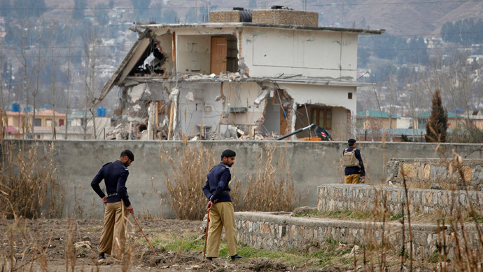 Policemen stand guard near the partially demolished compound where al Qaeda leader Osama bin Laden was killed by U.S. special forces last May, in Abbottabad February 26, 2012. Pakistani forces began demolishing the house where Bin Laden was killed by U.S. special forces last May, in an unexplained move carried out in the dark of night. (Reuters / Faisal Mahmood)