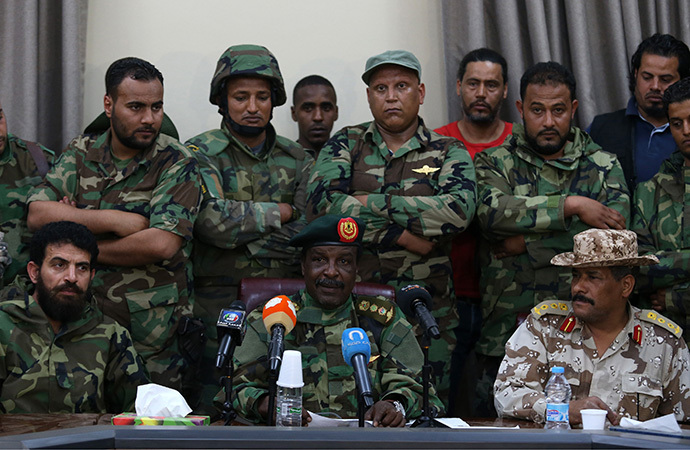 Libyan Army Special Forces Commander Wanis Bukhamada (front C) delivers a statement in Benghazi May 19, 2014. Bukhamada has allied with renegade general Khalifa Haftar in his campaign against militant Islamists, highlighting the failure of central government in Tripoli to assert its authority. (Reuters / Esam Al-Fetori)