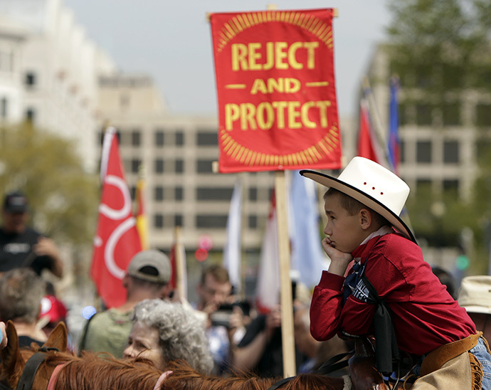 Mason Mitchell, a young member of the Cowboys and Indian Alliance, a group of ranchers, farmers and indigenous leaders, participates in protests against the Keystone XL pipeline in Washington April 22, 2014. (Reuters / Gary Cameron)