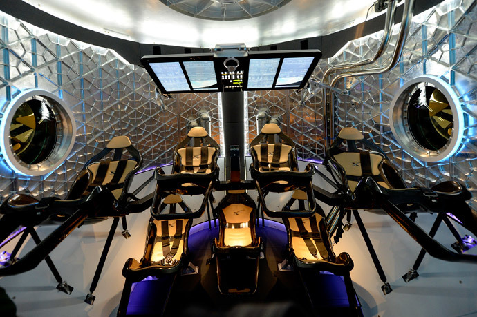 A view of inside the Dragon V2 manned capsule designed to carry astronauts after it was unveiled by SpaceX CEO Elon Musk during a news conference on May 29, 2014, in Hawthorne, California. (Kevork Djansezian / Getty Images / AFP) 