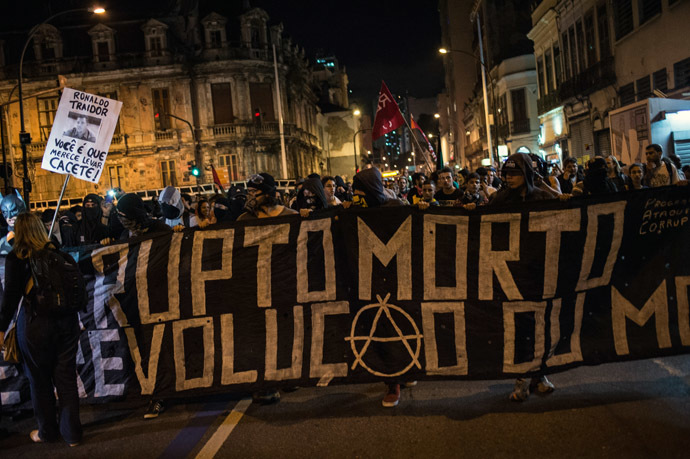 Members of the anarchist group Black Bloc protest against the FIFA World Cup in Rio de Janeiro, Brazil, on May 30, 2014. (AFP Photo/YASUYOSHI CHIBA)