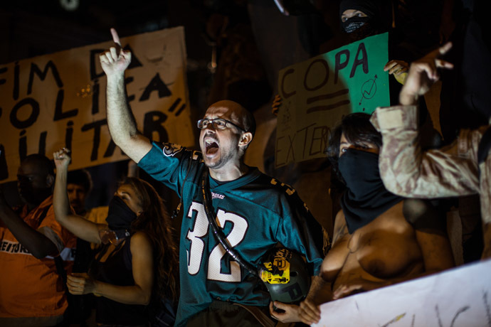 Members of the anarchist group Black Bloc protest against the FIFA World Cup during their demonstration in Rio de Janeiro, Brazil, on May 30, 2014. (AFP Photo/YASUYOSHI CHIBA)