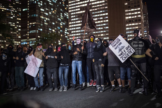 Members of the anarchist group Black Bloc protest against the FIFA World Cup in Rio de Janeiro, Brazil, on May 30, 2014. (AFP Photo/YASUYOSHI CHIBA)