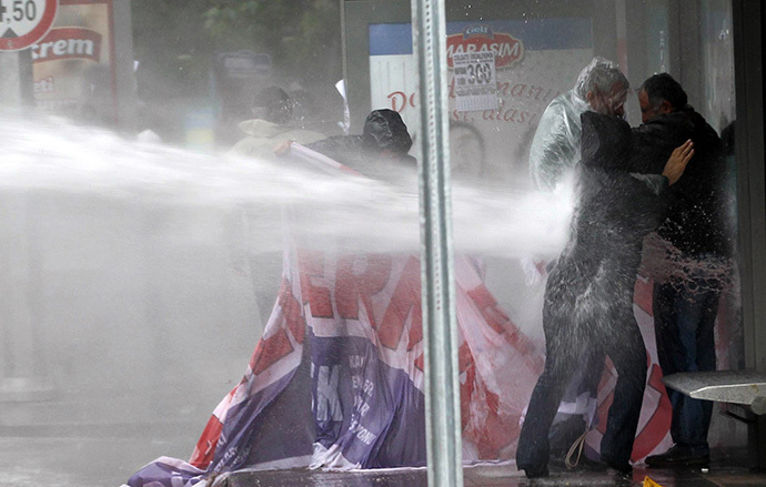 Turkish police fire water cannons at protesters gathered on June 1, 2014 in Ankara to mark the one-year anniversary of anti-government protests in June 2013. (AFP Photo / Adem Altan)