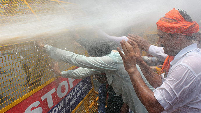 Water cannons deployed as hundreds in India protest gang-rape, killing of 2 teen girls
