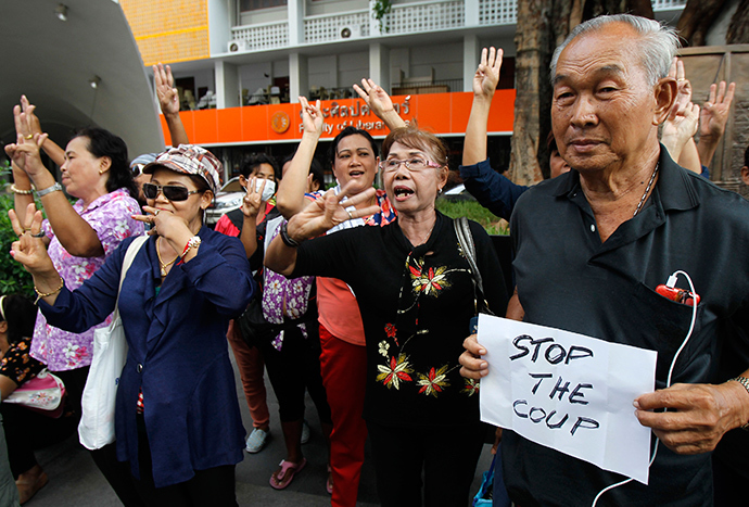 Protesters take part in a brief protest against military rule at Thammasat University in Bangkok June 1, 2014 (Reuters / Chaiwat Subprasom)