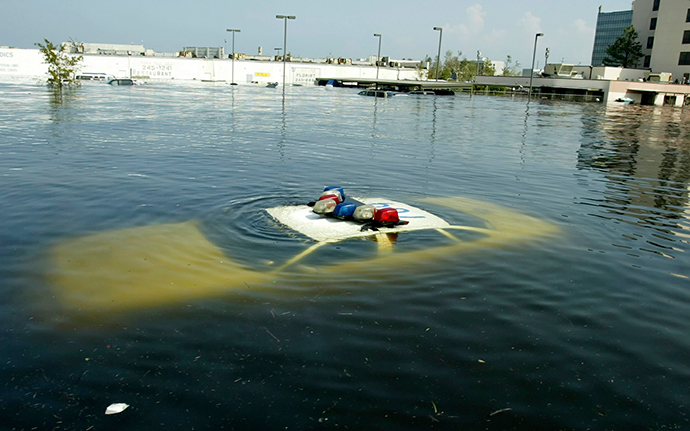 A police car is submerged in New Orleans East August 31, 2005 after Hurricane Katrina hit the area (Reuters)