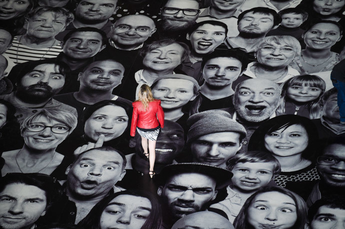 A woman visits the exhibition "Au Pantheon!" by French photographer JR displayed on the ground of the Pantheon in Paris, a secular temple which contains the remains of distinguished French citizens, on June 3, 2014. (AFP Photo / Martin Bureau)