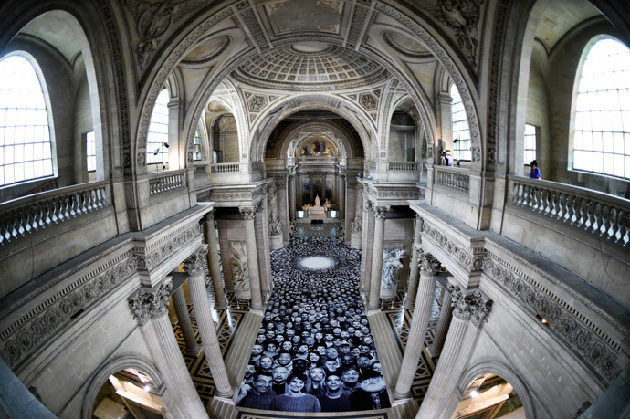 People visit the exhibition "Au Pantheon!" by French photographer JR at the Pantheon in Paris, a secular temple which contains the remains of distinguished French citizens, on June 3, 2014. (AFP Photo / Martin Bureau)