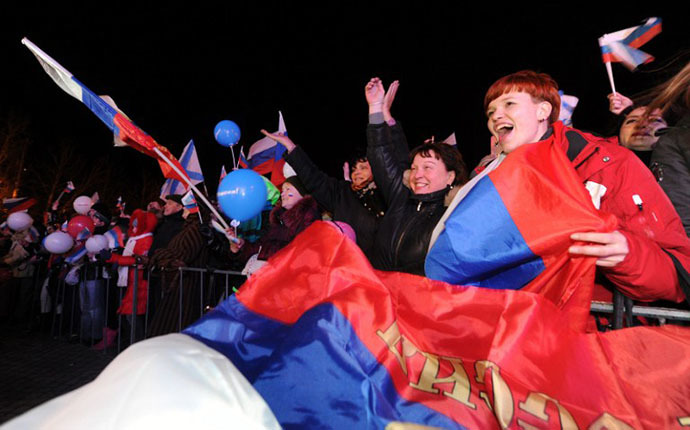 Crimeans celebrate in Sevastopol on March 16, 2014 after partial votes showed that about 95.5 percent of voters in Ukraine's Crimea region supported union with Russia. (AFP Photo / Viktor Drachev)