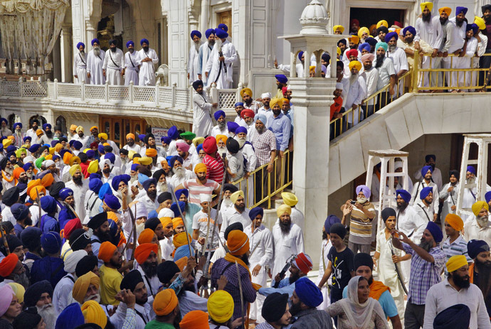 Sikhs gather during their clash inside the complex of the holy Sikh shrine, the Golden Temple, in the northern Indian city of Amritsar June 6, 2014. (Reuters/Munish Sharma)