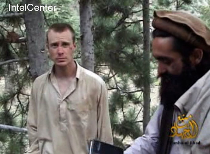 This still image provided on December 7, 2010 by IntelCenter shows the Taliban associated video production group Manba al-Jihad December 7, 2010 release of US Sergeant Bowe Bergdahl (L), who has been held hostage by the Taliban since his disappearance from his unit on June 30, 2009. (AFP Photo)