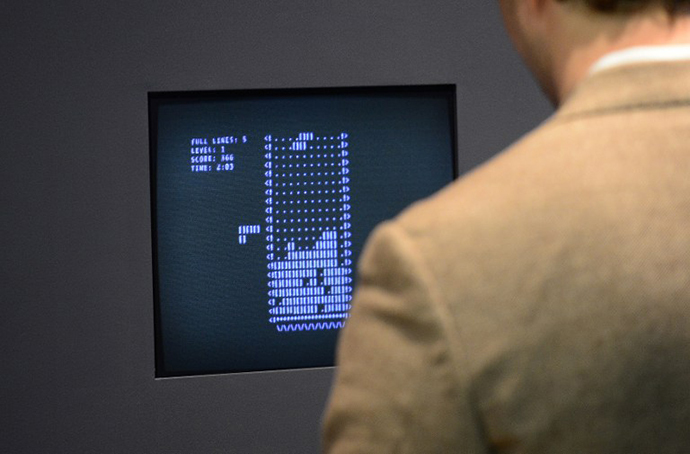 A visitor plays the video game Tetris (1984) during an exhibition preview featuring 14 video games acquired by The Museum of Modern Art (MoMA) in New York (AFP Photo / Emmanuel Dunand)