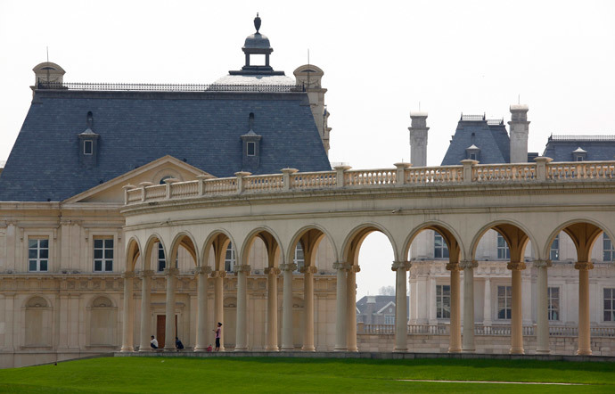People are seen between pillars that make up the luxurious Chateau Laffitte Hotel, an imitation of the 1650 ChÃ¢teau Maisons-Laffitte by the French architect FranÃ§ois Mansart, located on the outskirts of Beijing (Reuters / David Gray)
