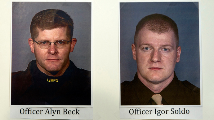 Photos of slain Metro Police officers Alyn Beck and Igor Soldo are displayed during a news conference at Metro headquarters following the death of the two officers and a citizen in Las Vegas June 8, 2014 (Reuters / Steve Marcus)