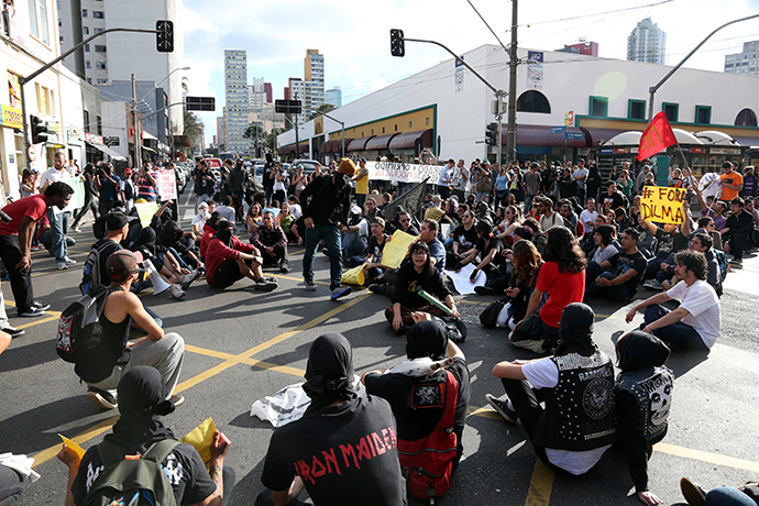 People run away from tear gas fired by police during the fifth day of metro worker's protest in Sao Paulo June 9, 2014 (Reuters / Stringer)