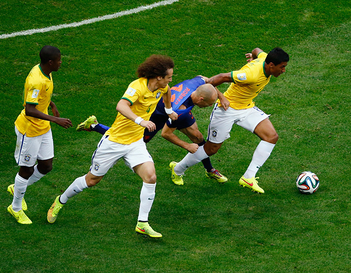 Arjen Robben of the Netherlands (2nd R) fouls Brazil's Paulinho (R) beside Brazil's David Luiz and Maicon during their 2014 World Cup third-place playoff at the Brasilia national stadium in Brasilia July 12, 2014. (Reuters / Ruben Sprich) 