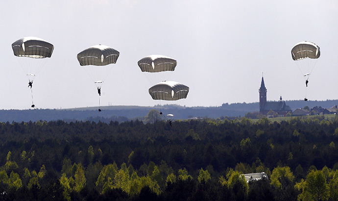 Troops from the U.S. Army's 173rd Infantry Brigade Combat Team parachute during a NATO-led exercise "Orzel Alert" held together with Canada's 3rd Battalion and Princess Patricia's Light Infantry, and Poland's 6th Airborne Brigade in Bledowska Desert in Chechlo, near Olkusz, south Poland (Reuters / Kacper Pempel)