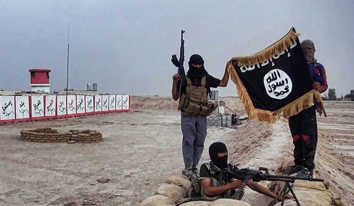 Militants of the Islamic State of Iraq and the Levant (ISIL) posing with the trademark Jihadists flag after they allegedly seized an Iraqi army checkpoint in the northern Iraqi province of Salahuddin on June 11, 2014. (AFP Photo / HO / Welayat Salahuddin)