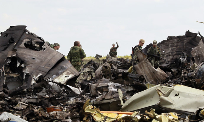 Self-defense forces search for ammunition at the site of the crash of the Il-76 Ukrainian army transport plane in Luhansk, June 14, 2014. (Reuters/Shamil Zhumatov)