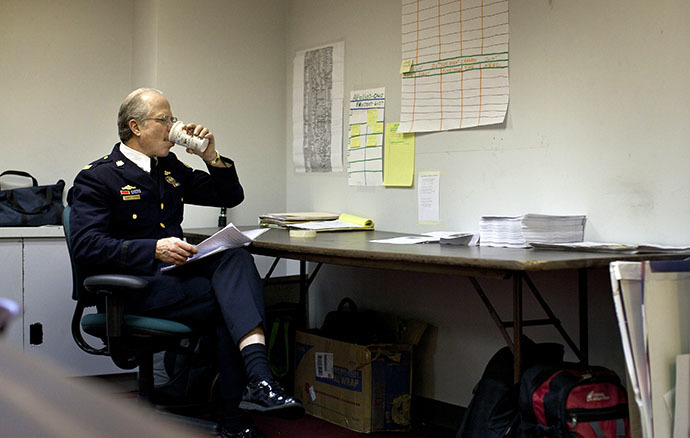Retired Philadelphia police Captain Ray Lewis sits at a desk in an office space being used by organizers of the Occupy Wall Street movement at 50 Broadway in New York December 7, 2011. (Reuters / Andrew Burton)