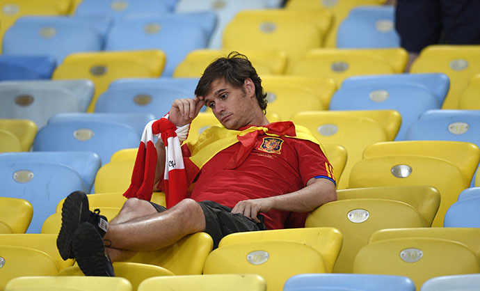 A Spain fan reacts after the Group B football match between Spain and Chile in the Maracana Stadium in Rio de Janeiro during the 2014 FIFA World Cup on June 18, 2014. (AFP Photo / Lluis Gene)