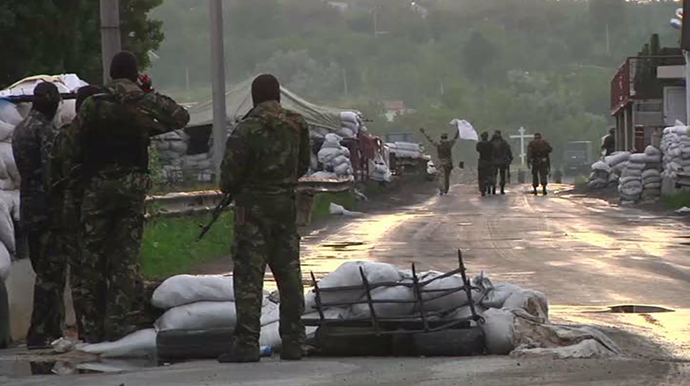 Militiamen at a handover point. Still from AP video