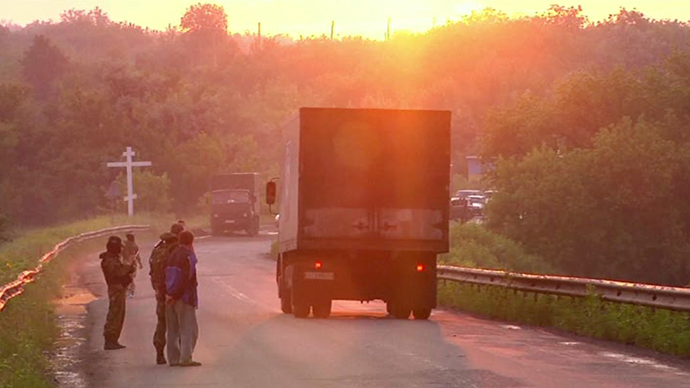 Truck containing bodies passing by on road to Ukrainian side. Still from AP video