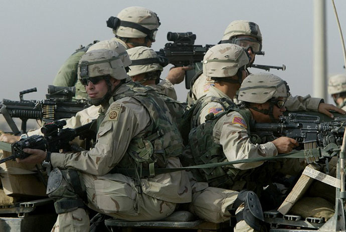 US troops from the 82nd Airborne division take position during a search for a weapons cache in Fallujah, 50 kms (30 miles) west of Baghdad, 07 November 2003. (AFP photo / Patrick Baz)