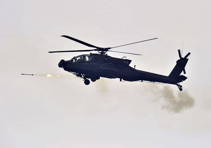 A US AH-64 Apache helicopter fires rockets (AFP Photo / Jung Yeon-Je) 