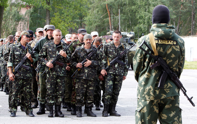 Members of the "Donbass" self-defence battalion attend a ceremony to swear the oath to be officially included into the reserve battalion of the National Guard of Ukraine near Kiev June 23, 2014. (Reuters / Valentyn Ogirenko)
