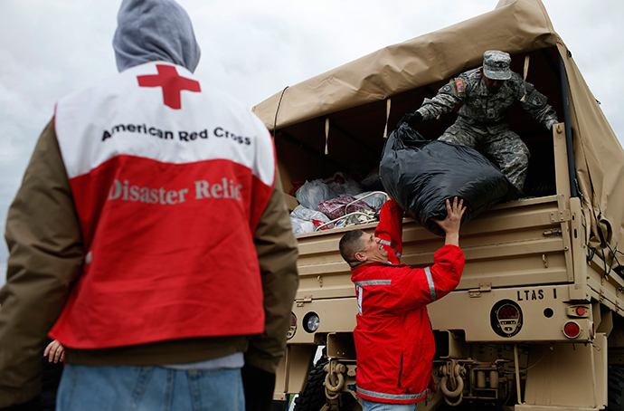 ARCHIVE PHOTO: U.S. National Guard and American Red Cross volunteers unload donated supplies for hurricane Sandy victims at a FEMA and American Red Cross aid and disaster relief station in the hard-hit Staten Island section of New York City, November 2, 2012 (Reuters / Mike Segar)