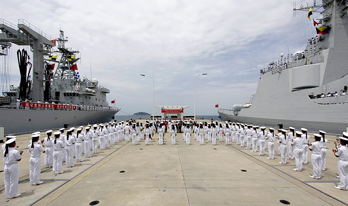 Chinese navy sailors stand in formation as they attend a send-off ceremony before departing for the Rim of the Pacific exercise (RIMPAC), at a military port in Sanya, Hainan province June 9, 2014 (Reuters / Stringer)