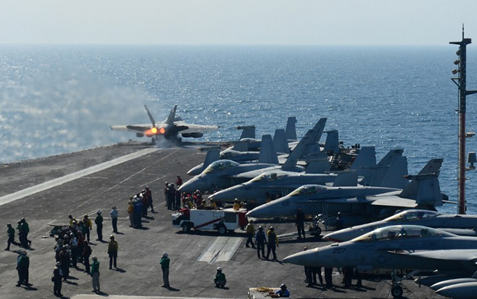 In this image released by the US Navy, an F/A18C Hornet launches off the flight deck of the aircraft carrier USS George H.W. Bush during flight operatuions in the Arabian Gulf on June 17, 2014. (AFP Photo / Harry Andrew D. Gordon)