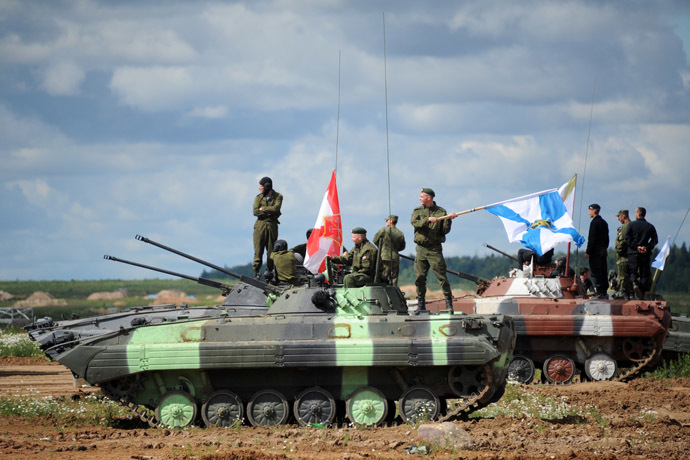 Crews of BMD-4M armored infantry fighting vehicles during Tank Biathlon 2014 competition held at the shooting range of the 2nd Guards Motor Rifle Tamanskaya Division in Alabino village. (RIA Novosti/Kirill Kallinikov)